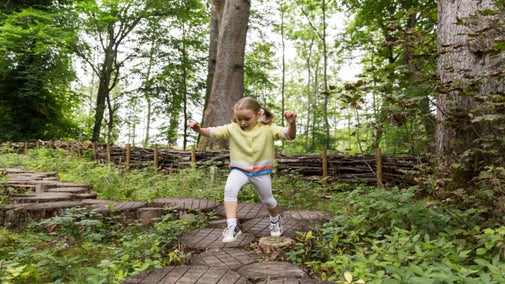Girl at the Little Acorns nature play space, Wallington, Northumberland